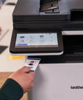 Person using security card on Color Laser All In One Printer With Duplex Printing, Scan And Copy, Fast 33 Pages Per Minute