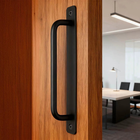 Side view of Two Pack Sliding Barn Door Handle With Plate, 7 Inch Aluminum Alloy Door Pull, Black Finish, installed on a wood door.