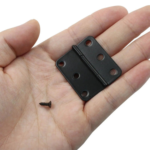 Killer 24 Pack Of 1.5 Inch Black Butt Hinges For Doors And Cabinets Hella Durable Steel Hardware with screw in hand.