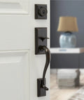 Hawthorne Front Door Lock Set With Deadbolt And Exterior Handleset, Venetian Bronze Finish featured on door.