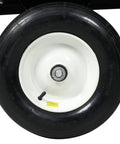 Close-up of tire on ATV Trailer Steel Dump Cart With 22 Cu Ft Capacity And 750 Lb Load, Heavy Duty Utility Trailer For Lawn And Garden