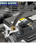 Heavy Duty Battery Disconnect Switch 12V 24V Power Cut Off installed on battery, showing brass and black material in vehicle.
