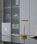 2 Pack Cordless Table Lamps Rechargeable With 5000mAh Battery on desk, brushed gold finish, alongside laptop in modern office.