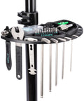 Close-up of bike repair stand tool tray with wrenches and hex keys; Bike Repair Stand With 360 Degree Rotating Clamp Holds Up To 110 Lbs Adjustable Jaws 1 To 1.5 Inches Workstand For Mountain And Road Bikes Great For Home Mechanics And Bicycle Shop Use.