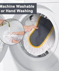 Machine washing the washable cotton pad of Straight Up 24 Inch Commercial Dust Mop Heavy Duty Floor Duster in a washing machine.