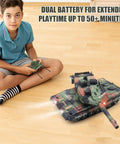Boy in blue shirt plays with Rugged RC Tank That Shoots For Kids And Teens 2 4GHz Remote Control Army Tank Toy on wood floor