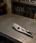 Heavy Duty Locking Radiator Hose Clamp Pliers With Strong Carbon Steel Jaws For Fast Welding Electrical Auto Repair And Quick Pinch Off Setup on metal workbench.