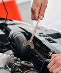 Person using Auto AC Compressor Repair Tool Set 3 Piece Disassembly Kit for quick compressor removal under the hood.