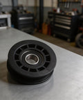 Durable Idler Pulley Replacement for Walk Behind Mowers, Plastic Construction, on Workbench