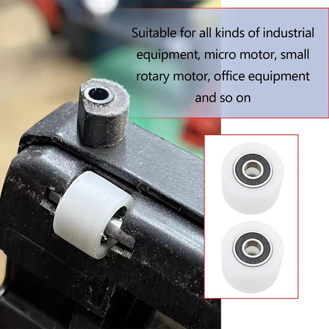 Close-up of two-pack nylon sliding pulley bearings 40x30mm with 6000ZZ on metal track in industrial setting.