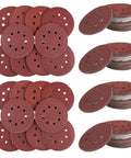 Get Your Hands On These 150 Inch Eight Hole Hook And Loop Sanding Discs Perfect For Your Orbital Sander With Tough Reliable Material To Resist Tearing And Wear For Less Frequent Replacement On Sheets Or Professional Jobs. Dark red 6 inch sanding discs stacked and arranged with 8 holes for dust control.