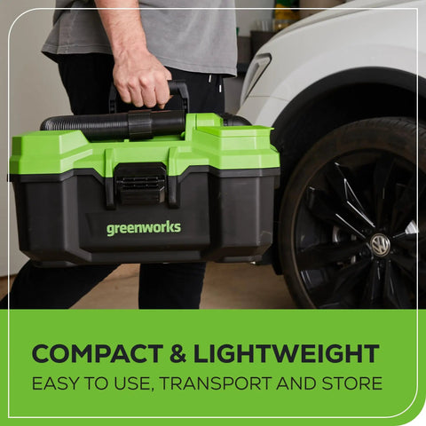 Person carrying Workhorse Cordless 3-Gallon Wet And Dry Shop Vacuum Kit beside car, showing compact and lightweight design.