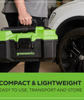 Person carrying 24V Brushless Cordless Wet Dry Shop Vacuum, 3-Gallon Capacity with green and black case near vehicle