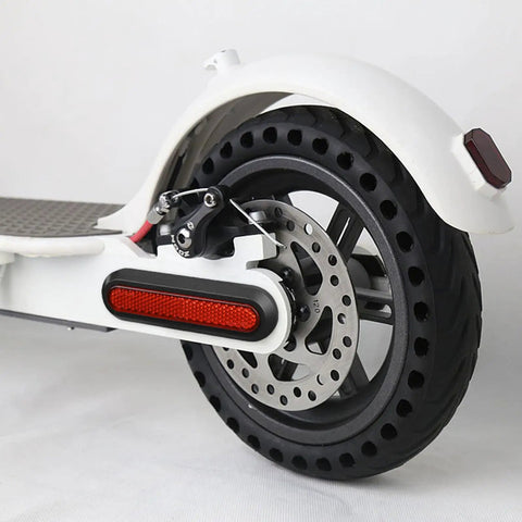 Rear wheel of electric scooter with Easy Snap On Reflective Wheel Covers For Electric Scooters Front And Rear No Fuss Quick Install.