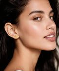 Implant Grade F136 Titanium Cubic Zirconia Stud Earrings Secure Screw Back Ultra Light Hypoallergenic For Sensitive Ears worn by a woman.