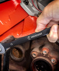 Close-up of a hand using 9 Piece X10 12 Point Long Pattern Combination Metric Wrench Set Pro Grade Heavy Duty Alloy Steel on engine