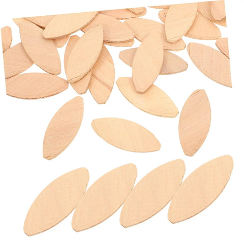 Top Shelf Wood Joining Biscuits And Joint Plates For Zero Hassle Furniture Assembly scattered light yellow hardwood cutouts on white background.