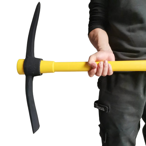 Person holding Beast Mode Heavy Duty Forged Mattock With Adze And Ergonomic Non Slip Handle for gardening and outdoor use.