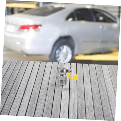 90 Degree Stainless Steel Grease Nozzle Kit With Angled Fittings displayed on wooden surface, car in background.