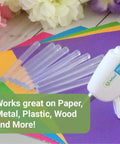 Clear Mini Hot Glue Sticks 4 Inch, 550 Count, All Temp Bonding on colored paper beside mini glue gun