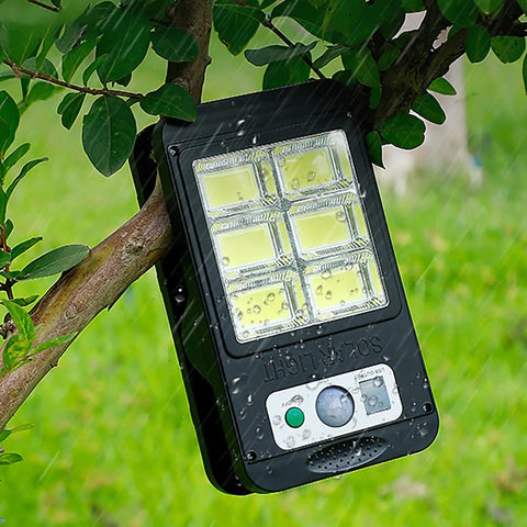 Portable LED light unit hanging from a tree branch, showing waterproof design, suitable for High Power 3kW Hydroelectric Turbine Generator For Outdoor Rivers And Mountains, Portable 3500 RPM Off Grid Power Unit With LED Lights, Ideal For Home Use, Camping, Remote Sites, Direct Injection Pelton Style Turbine.