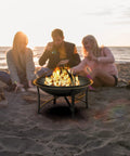 Outdoor Wood Burning Fire Pit For Backyard Camping Steel Fire Bowl With Spark Screen Cover Log Grate And Poker on beach