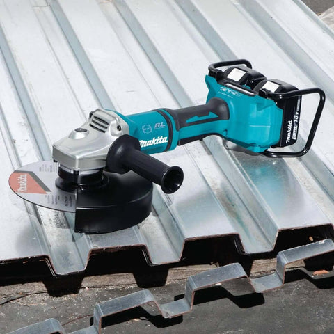 Kickass 36V Brushless Angle Grinder And Cut Off Tool With 9 Inch Blades on metal roofing, showcasing dual 18V batteries and cutting disc.
