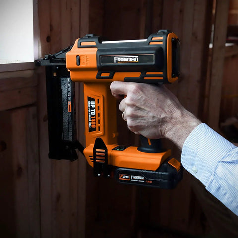 Person using 20V Cordless 2-In-1 18-Gauge Nailer And Stapler Tool Only For Quick Build Projects in framing work