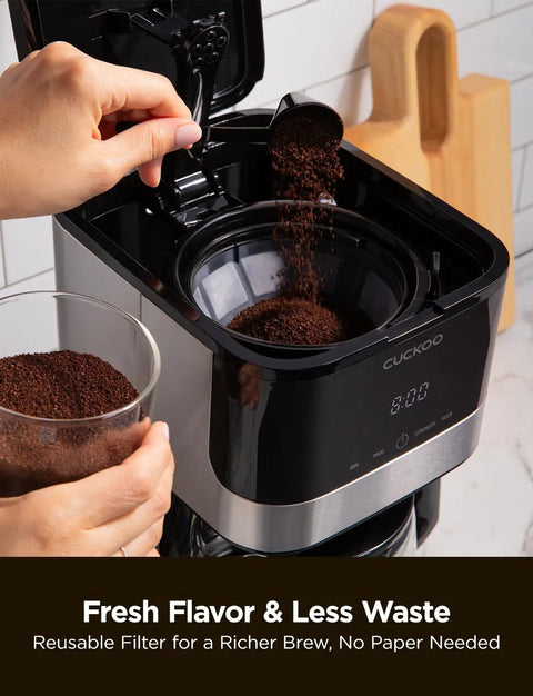 Filling coffee grounds into 10 Cup Drip Coffee Maker With 24 Hour Programmable Timer Glass Carafe And Reusable Mesh Filter Two Brew Strength Settings Easy To Use Eco Friendly Home Coffee Machine For Fresh Morning Brews.