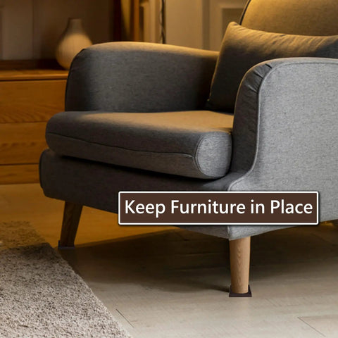 3x3 Square Rubber Furniture Caster Cups Anti Slip Pads Bed Stopper Floor Protectors under a grey sofa on a wooden floor