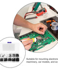 Person repairing electronics board using Pro Grade 1000Pcs Self Tapping Screws Set with clear plastic box in foreground