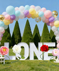 Outdoor wedding decor with balloon arch, large LOVE letters, and artificial flowers on Green Flexible PVC Tubing Three Pack With Aluminum Wire Core Pro Grade Bendable Stems 78.7 Inch For Artificial Flowers Balloon Arches Wedding Floral Decor DIY Crafts And Cosplay Props