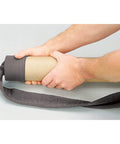 Hands sliding Hose Sock With Assembly Tube For 30 To 32 Feet Central Vacuum Hoses Gray onto a tube, showing easy installation.