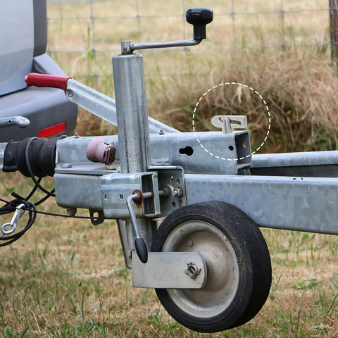 Rock-Solid Alloy Trailer Locking Pin With Long Screw For Secure Hitch Connector seen on trailer tongue with wheel support.