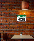 Funny Aluminum Safety Sign Wear Your Gear 8x12 Inch Wall Decor on brick wall in cozy room setting