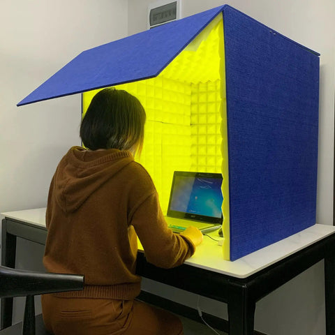 Solid Portable Desktop Soundproof Booth Cube Packed With Dense Acoustic Foam Panels for home studio vocal tracking in use.
