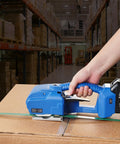 Top Shelf Portable Electric Strapping Machine For Smooth PP And PET Banding Operations With Dual Rechargeable Batteries and Clear Digital Screen in action sealing a box.