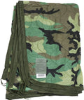 Authentic US Military Poncho Liner Woobie Blanket Woodland M81 Camouflage, folded, rugged military grade comfort, NSN tag visible
