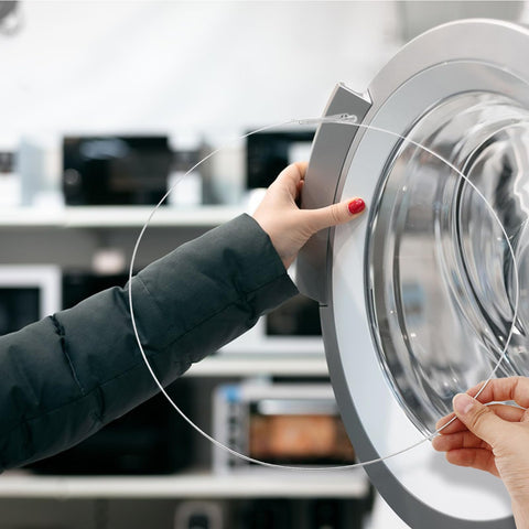 Close-up of a person holding stainless steel washing machine door boot spring clamp for front load washers