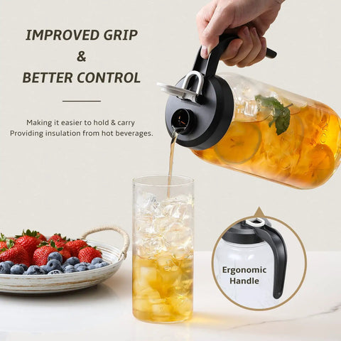 Pouring iced tea from 2 Quart Glass Pitcher With Lid Airtight Leakproof Mason Jar Pitcher into glass, fruits beside