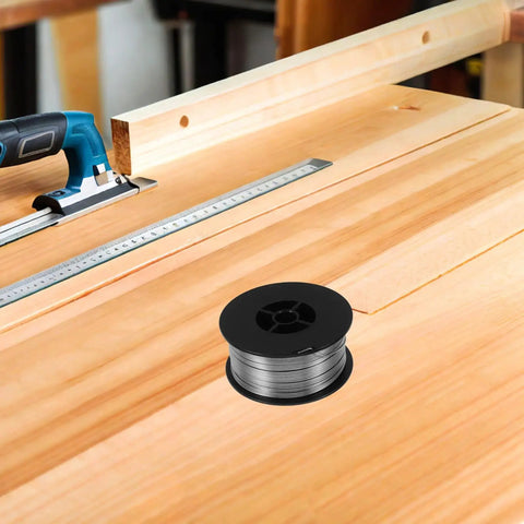 1KG Flux Core Welding Spool With Self-Shielding Metal Tin Wire For Precision Electronics Projects on a workbench.