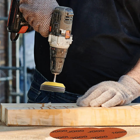 Man using drill with 130 Pcs 3 Inch Sanding Discs Kit Wet Dry Grit 60 To 10000 With One Eighth Inch And One Quarter Inch Shank Backer Plate