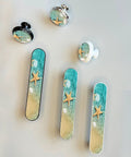 4 Pack Starfish Seashells Drawer Pulls Silver Three And Three Quarters Inch Center with coastal beach scene design