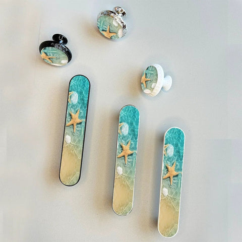 4 Pack Starfish Seashells Drawer Pulls Silver Three And Three Quarters Inch Center with coastal beach scene design