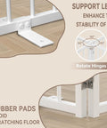 Close-up of support legs and rubber pads for stability on Short Dog Gate For Tiny Paws Under Fifteen Pounds With Foldable Four Panel Barrier Expands To Forty Eight Inches Wide Easy Doorway And Stair Fix In White.