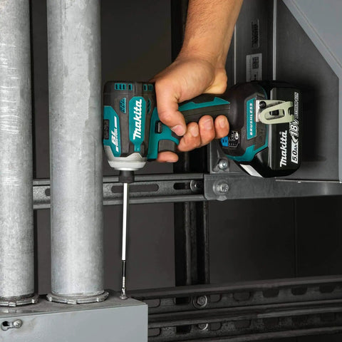 Person using Impact XPS No 2 Phillips Six Inch Power Bit with Precision Machined Tip and Torsion Ring in an impact driver for fastening