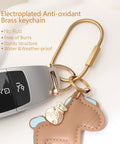 8 Pack Gold Carabiner Keychains With Brass Locking Clips And Screw Lock Key Rings attached to a car key and charm.