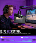 Person streaming with Gaming Microphone Kit For PC With XLR And USB Dynamic Mic Cardioid Mic Set Boom Arm RGB Lighting