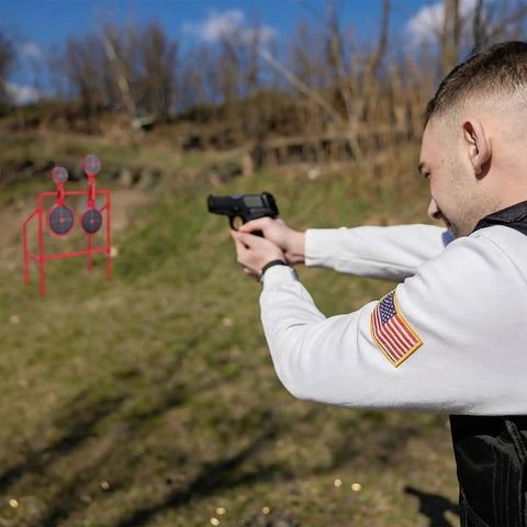 Man aiming at Double Spinner Shooting Targets Three Eighths Inch Thick Steel Auto Reset Target System With Four Plate Sizes