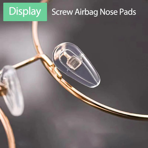 Buttery Soft Air Chamber Silicone Nose Pads For Glasses Sunglasses Replacement Kit With Mini Screwdriver And Spare Screws No More Pinching, close-up of clear airbag nose pad on gold eyeglass frame.